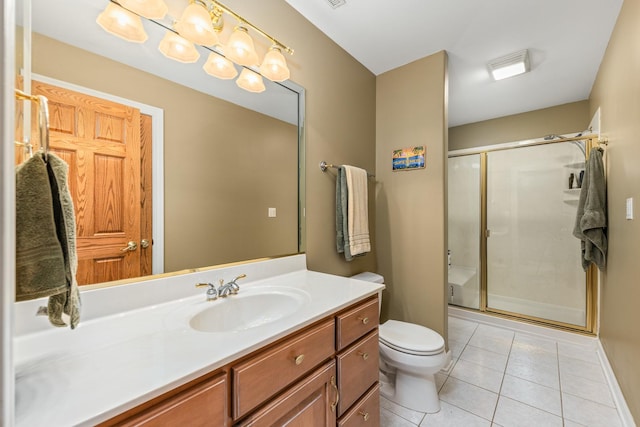 bathroom with visible vents, toilet, a shower stall, tile patterned flooring, and vanity