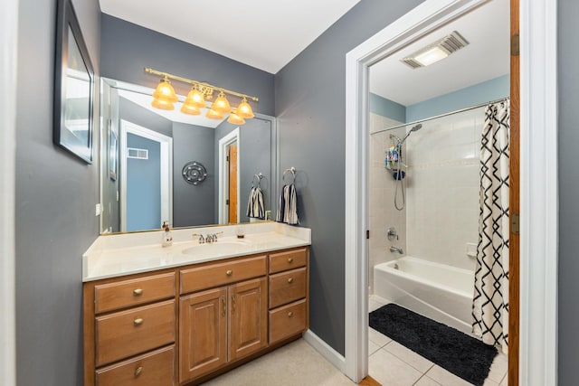 bathroom with vanity, baseboards, visible vents, tile patterned flooring, and shower / bath combination with curtain