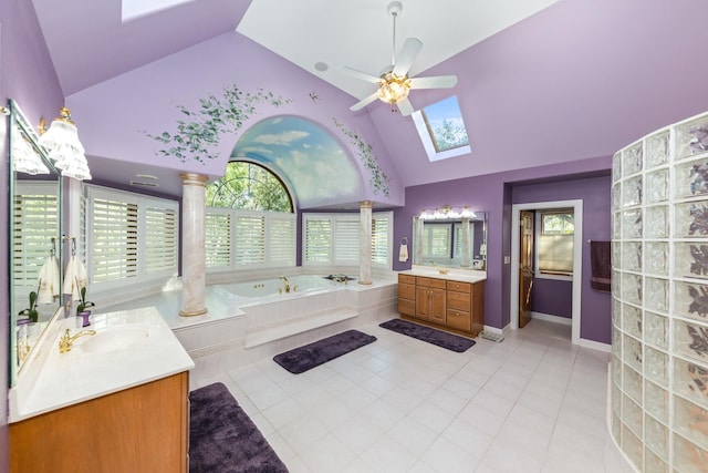 full bathroom with tile patterned flooring, a skylight, a wealth of natural light, and a sink