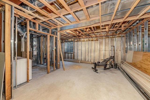 unfinished basement with washer / dryer