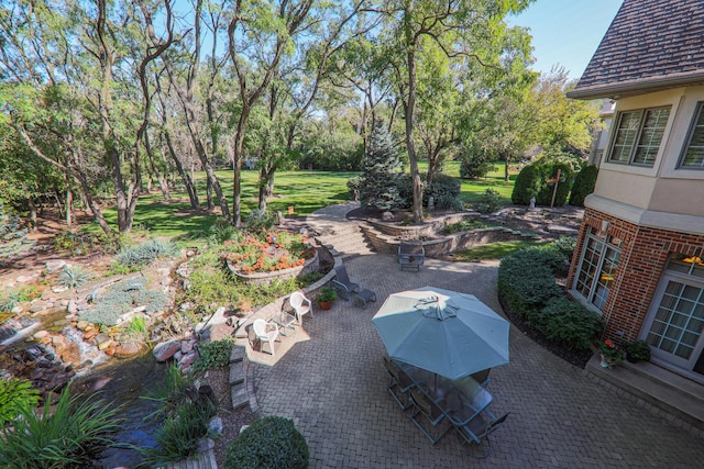 view of patio featuring outdoor dining area