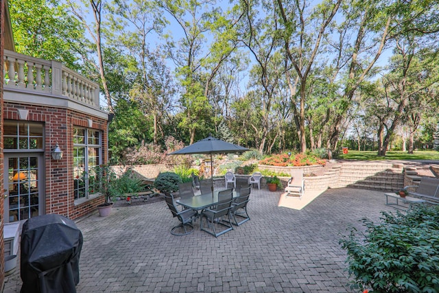 view of patio featuring area for grilling and outdoor dining space