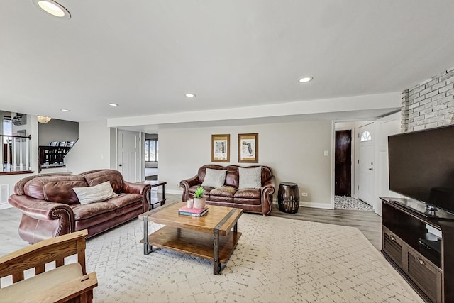 living room featuring visible vents, recessed lighting, baseboards, and wood finished floors