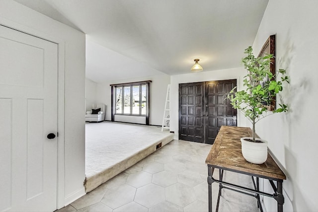 foyer featuring light tile patterned floors