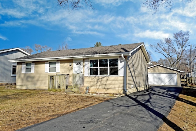 view of front facade featuring a garage and an outdoor structure