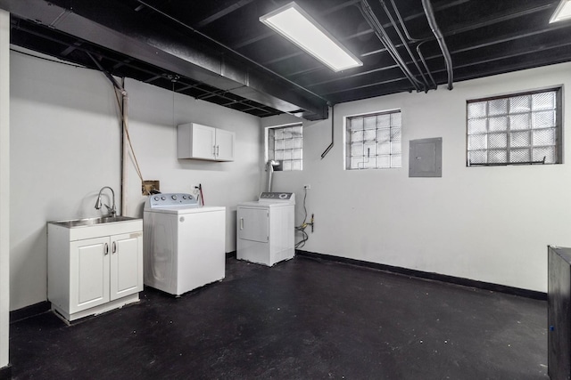 laundry room with washer and clothes dryer, a sink, electric panel, plenty of natural light, and cabinet space