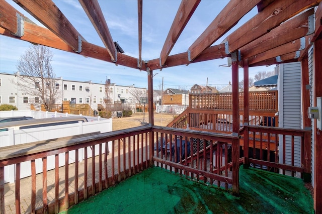 wooden terrace with a residential view