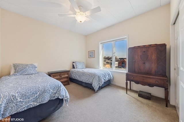 bedroom featuring baseboards, carpet, and ceiling fan