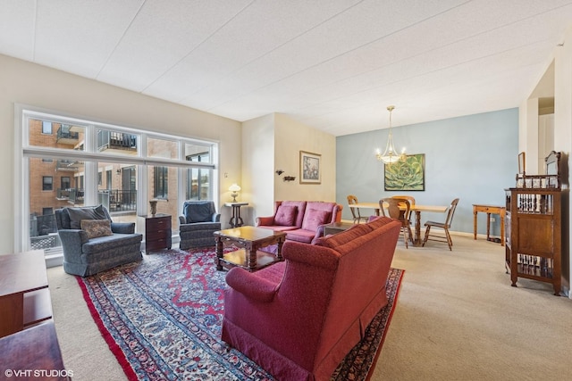 living area with light carpet, baseboards, and an inviting chandelier