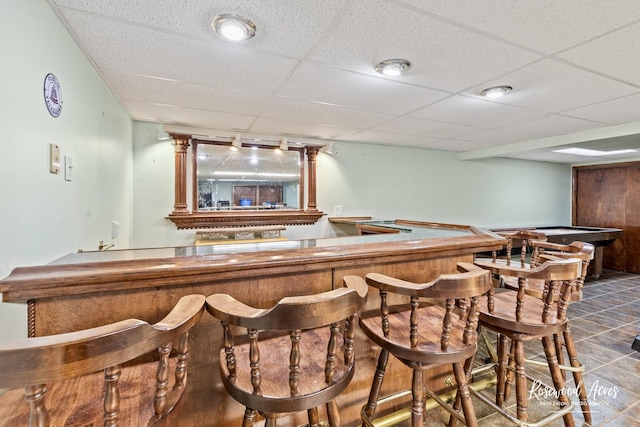 495 Water Tower Rd S, Manteno, IL 60950 - bar with a paneled ceiling, a community bar, and dark tile patterned floors
