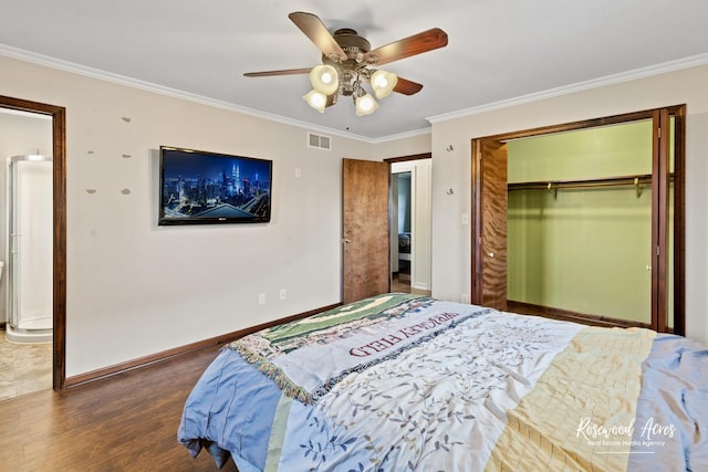 495 Water Tower Rd S, Manteno, IL 60950 - bedroom featuring wood finished floors, baseboards, white refrigerator, visible vents, and ornamental molding