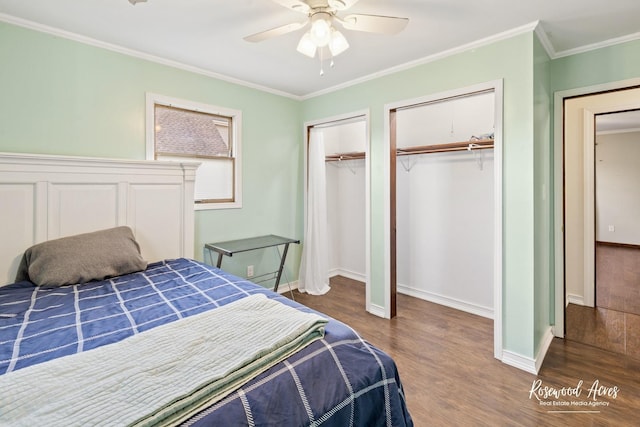 495 Water Tower Rd S, Manteno, IL 60950 - bedroom featuring crown molding, baseboards, wood finished floors, and two closets