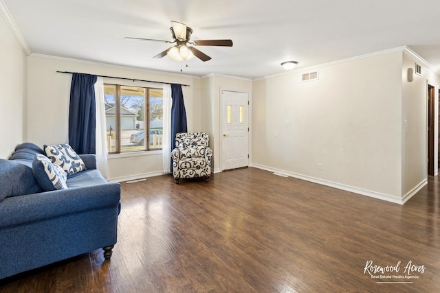495 Water Tower Rd S, Manteno, IL 60950 - living area featuring ornamental molding, baseboards, ceiling fan, visible vents, and wood finished floors