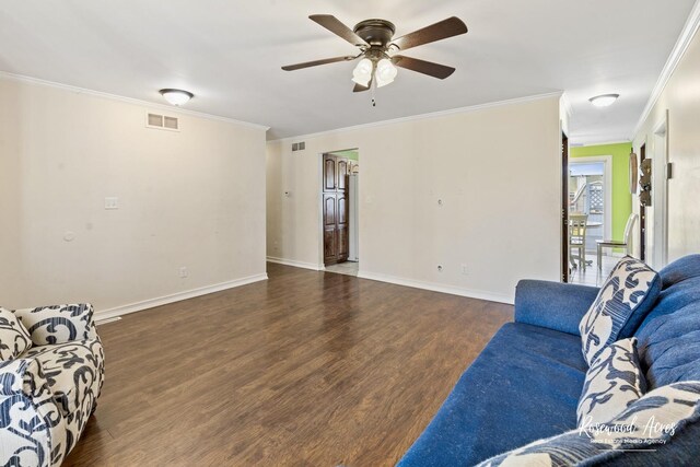 495 Water Tower Rd S, Manteno, IL 60950 - living area featuring ornamental molding, baseboards, ceiling fan, visible vents, and wood finished floors
