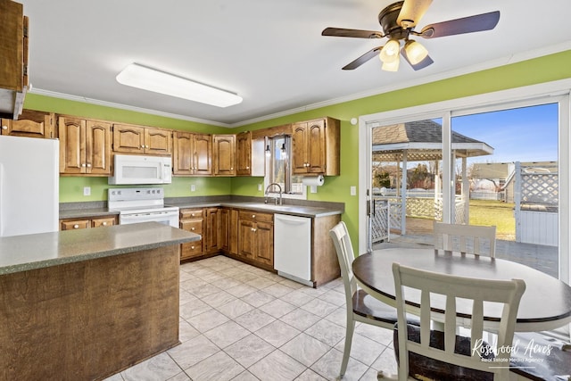 495 Water Tower Rd S, Manteno, IL 60950 - kitchen with ornamental molding, dark countertops, a ceiling fan, and white appliances