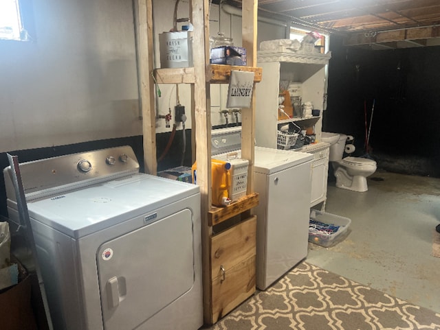 washroom with washer and dryer and laundry area