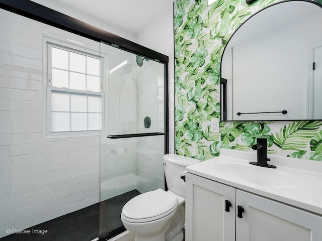 full bath featuring toilet, a stall shower, wallpapered walls, and vanity