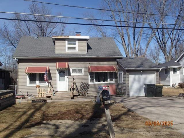 bungalow with a garage and driveway