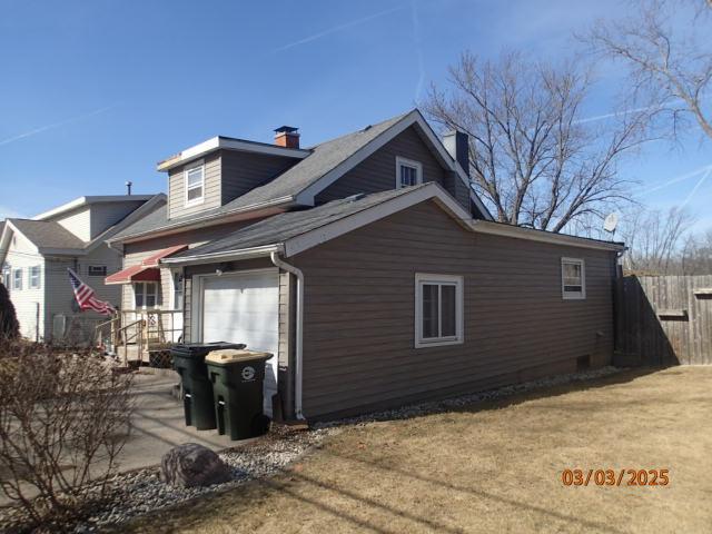 view of property exterior with fence