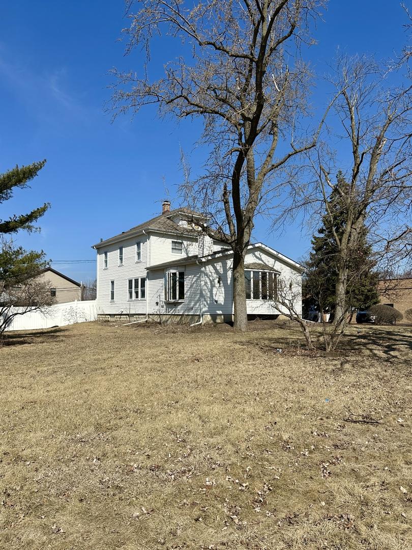 806 E Saint Charles Rd, Lombard, IL 60148 - rear view of property with a chimney