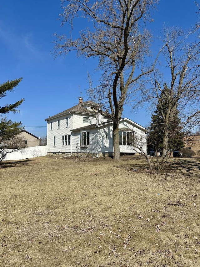 806 E Saint Charles Rd, Lombard, IL 60148 - rear view of property with a chimney