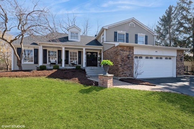 view of front of property featuring brick siding, a front lawn, aphalt driveway, a porch, and a garage