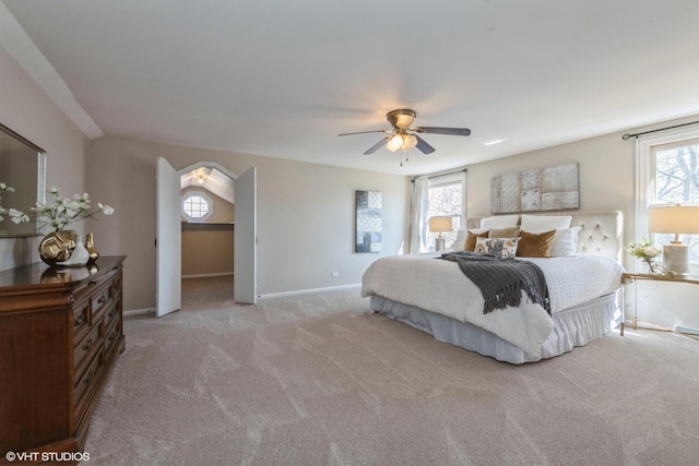 carpeted bedroom with baseboards and ceiling fan