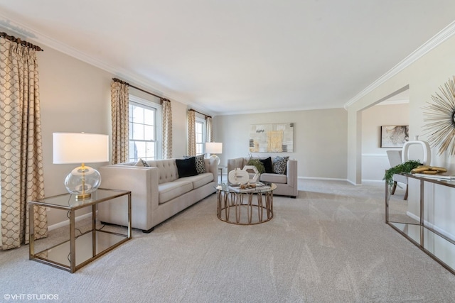 living area featuring baseboards, carpet floors, and ornamental molding