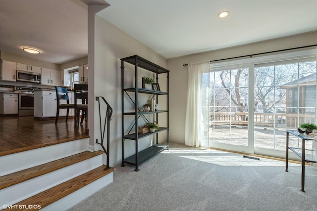 stairway featuring carpet flooring, recessed lighting, and visible vents