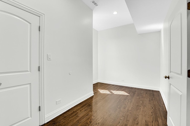 interior space with dark wood-style floors, visible vents, recessed lighting, and baseboards