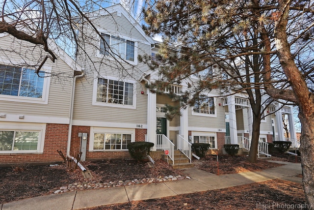 view of front of home featuring brick siding