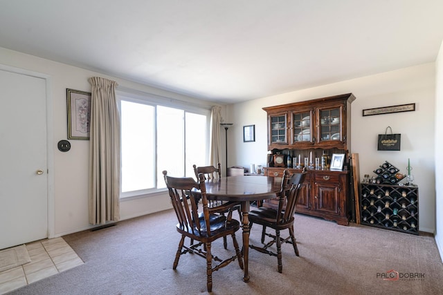 dining area with light carpet