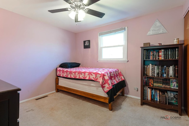 bedroom with visible vents, baseboards, a ceiling fan, and carpet flooring