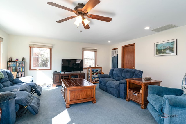 living room with recessed lighting, a ceiling fan, visible vents, and light carpet