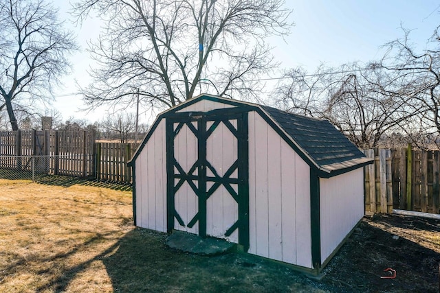 view of shed with a fenced backyard