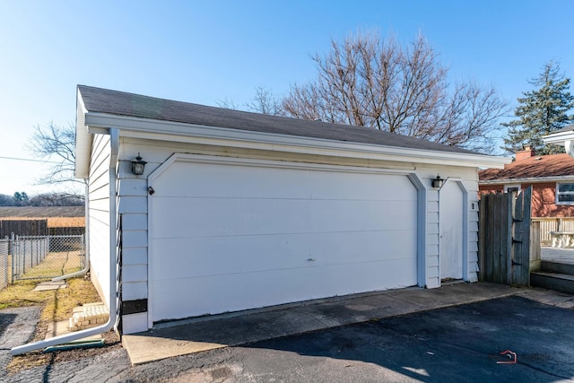 detached garage with fence