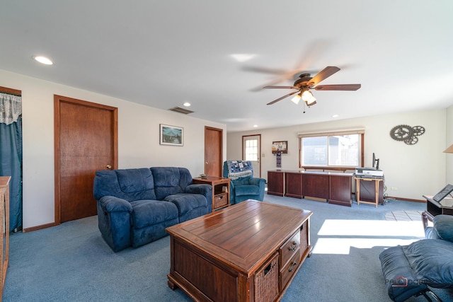 carpeted living area with visible vents, recessed lighting, baseboards, and ceiling fan