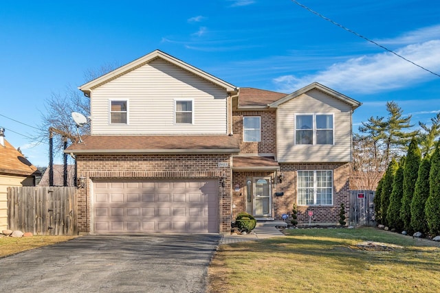 view of front of property with aphalt driveway, a garage, fence, and brick siding