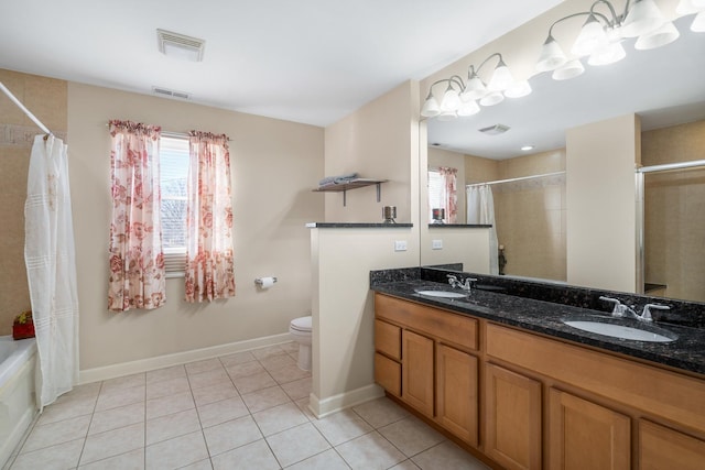 bathroom with tile patterned flooring, visible vents, and a sink