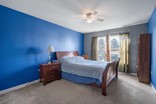 carpeted bedroom featuring visible vents, ceiling fan, and baseboards