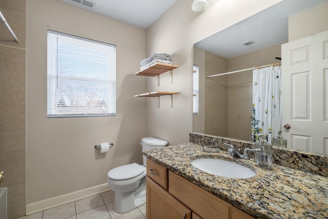 bathroom featuring baseboards, a shower with curtain, toilet, and tile patterned flooring