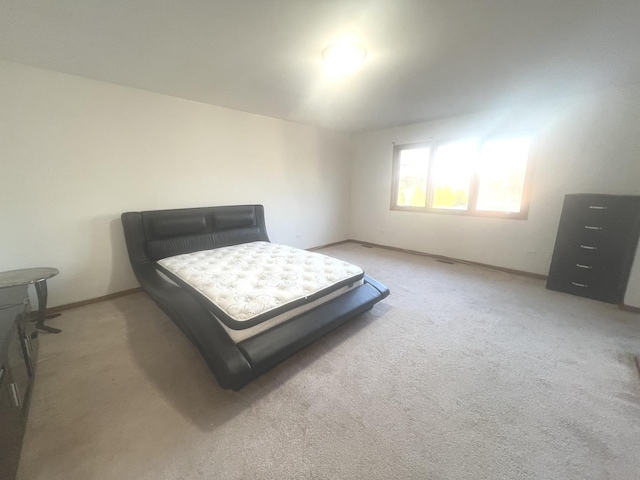 bedroom with light carpet