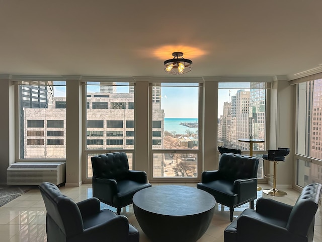 living area featuring light tile patterned floors, a city view, a wall of windows, and a wall mounted AC