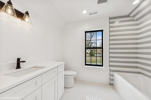 full bath featuring visible vents, toilet, a bathing tub, recessed lighting, and tile patterned flooring