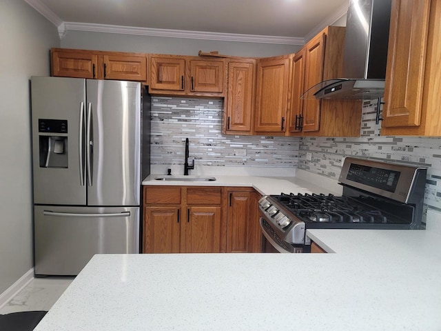 kitchen with wall chimney range hood, light countertops, appliances with stainless steel finishes, marble finish floor, and a sink