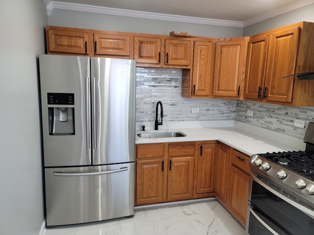 kitchen with ornamental molding, a sink, light countertops, appliances with stainless steel finishes, and marble finish floor