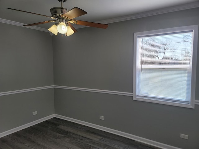 unfurnished room with a ceiling fan, dark wood-type flooring, crown molding, and baseboards