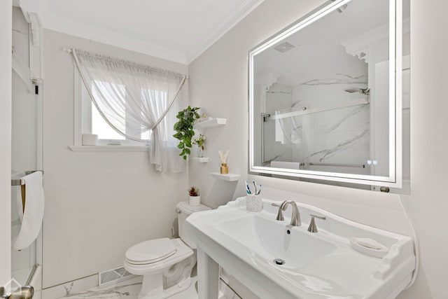 full bathroom featuring toilet, marble finish floor, a sink, a marble finish shower, and crown molding