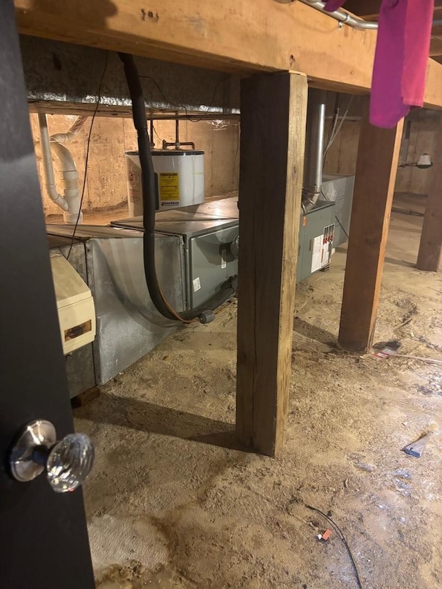 unfinished basement featuring electric water heater