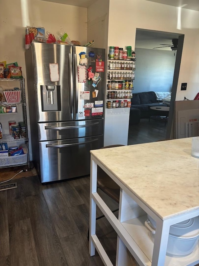 kitchen with ceiling fan, light countertops, stainless steel refrigerator with ice dispenser, and dark wood-style flooring